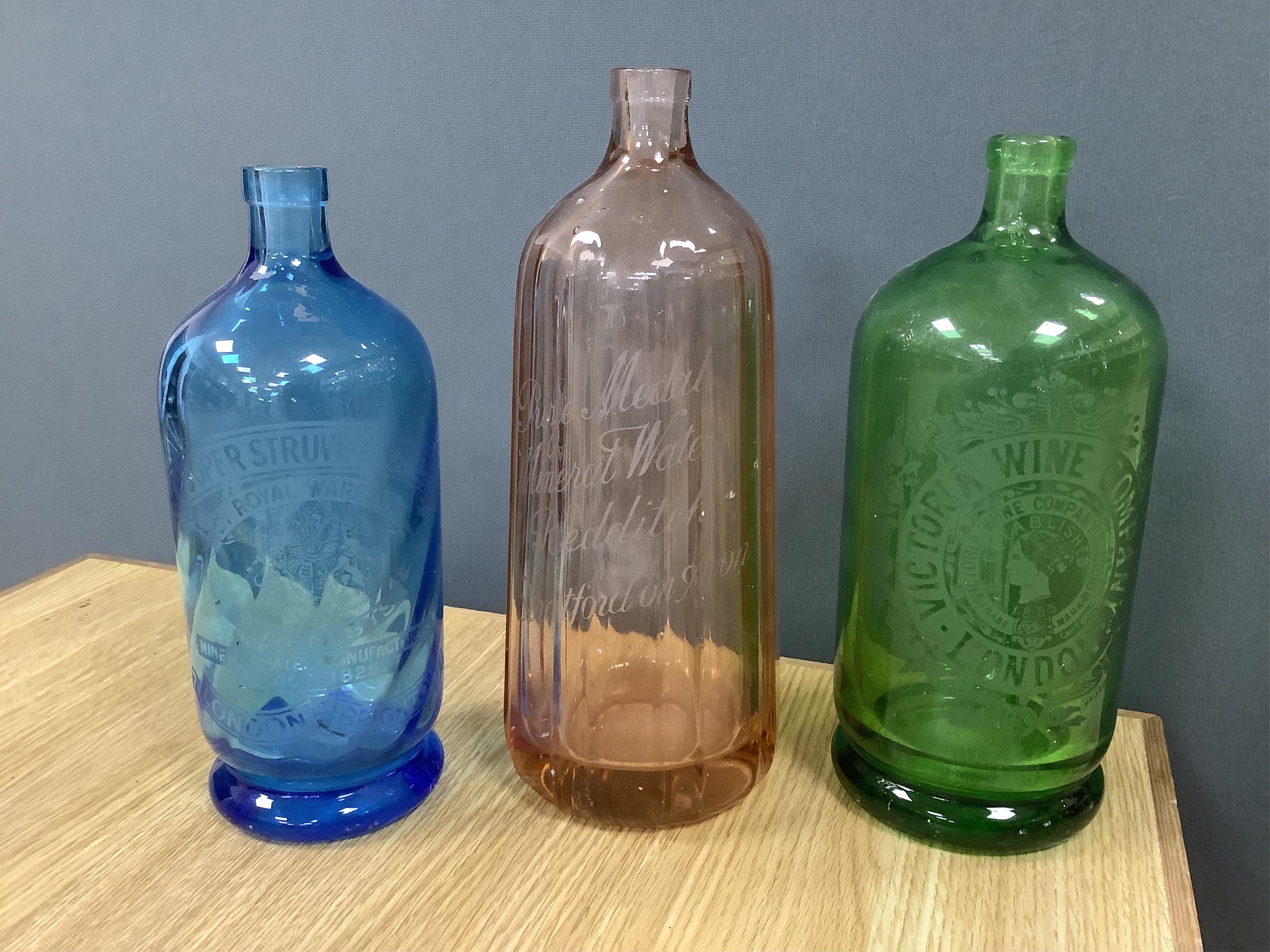 An Edwardian Standard English Seltzogenes double gourd Soda Syphon, one other and a collection of coloured glass bottles. Condition - varies